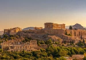 Monument building in Greece surrounded by trees. 